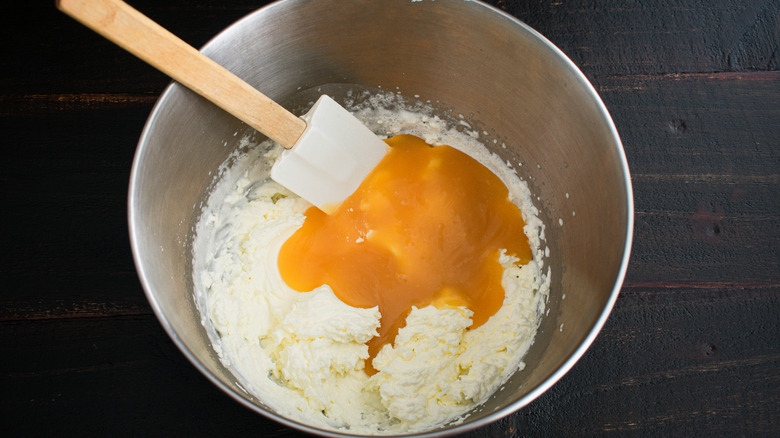 folding lemon curd into cream