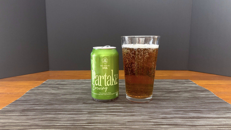 Partake IPA in pint glass on bar mat