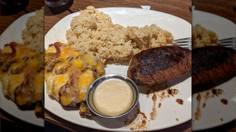 outback chicken and rice on plate