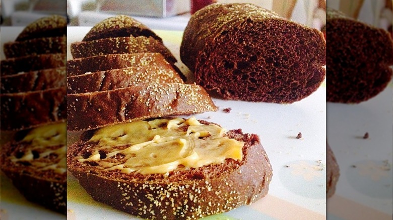 honey wheat bread with butter on counter