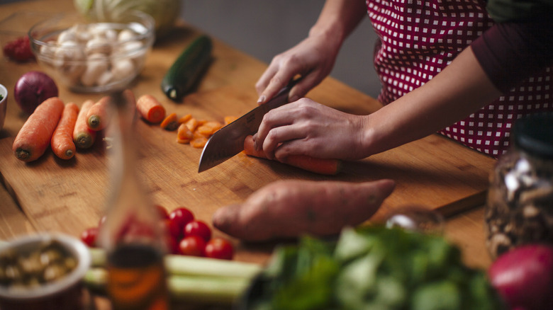 vegetables and carrots being chopped