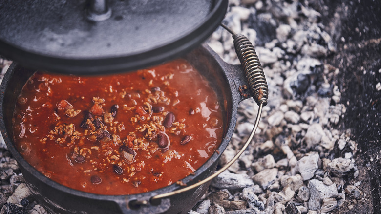 chili cooking in Dutch oven