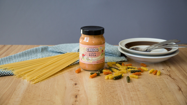 pink alfredo sauce in jar