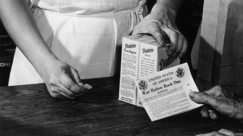 person using ration book for sugar during WWII