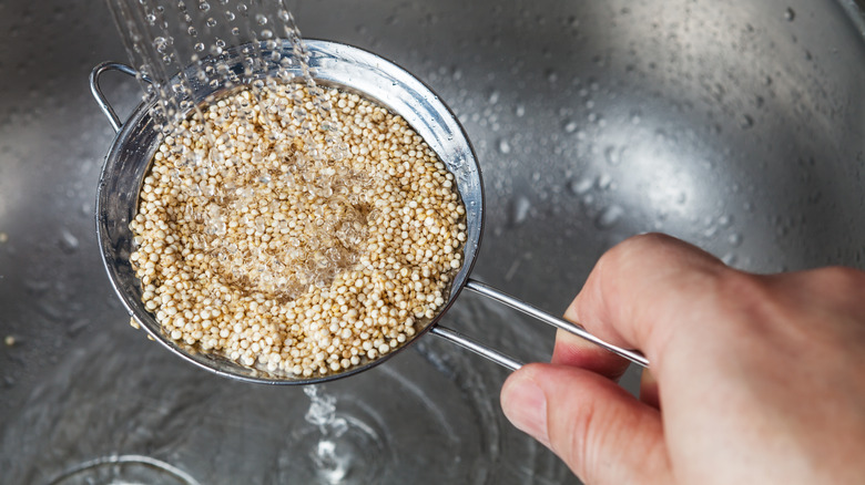 rinsing quinoa in strainer