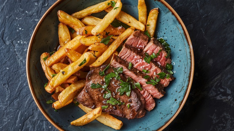 steak and fries on plate