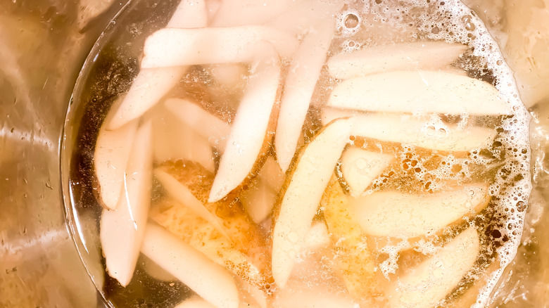 fries soaking in water