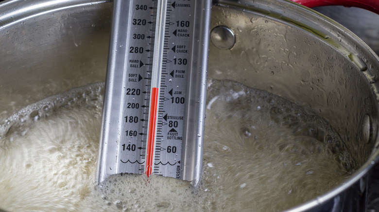 candy thermometer in sugar syrup