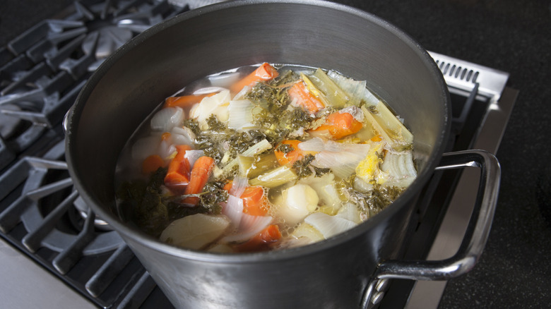 Vegetable broth in pot on stove