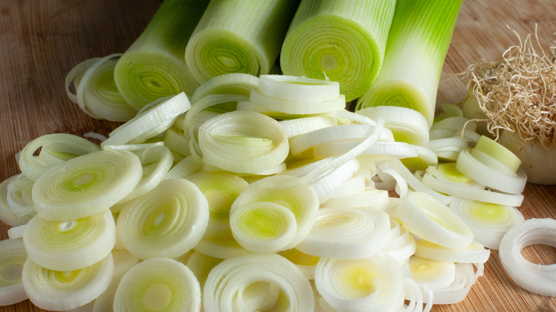 sliced leeks on wooden cutting board