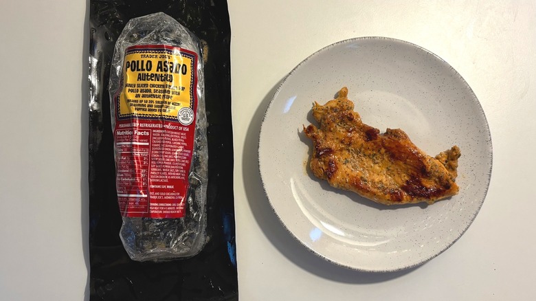 Trader Joe's Pollo Asado Autentico package next to plate of chicken on white table