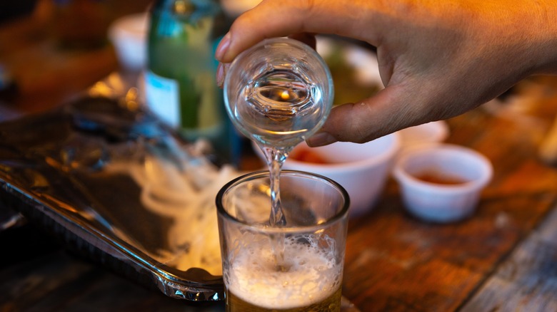 Hand mixing soju and beer