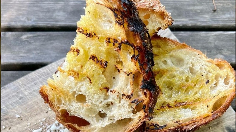 Grilled bread on wooden board 