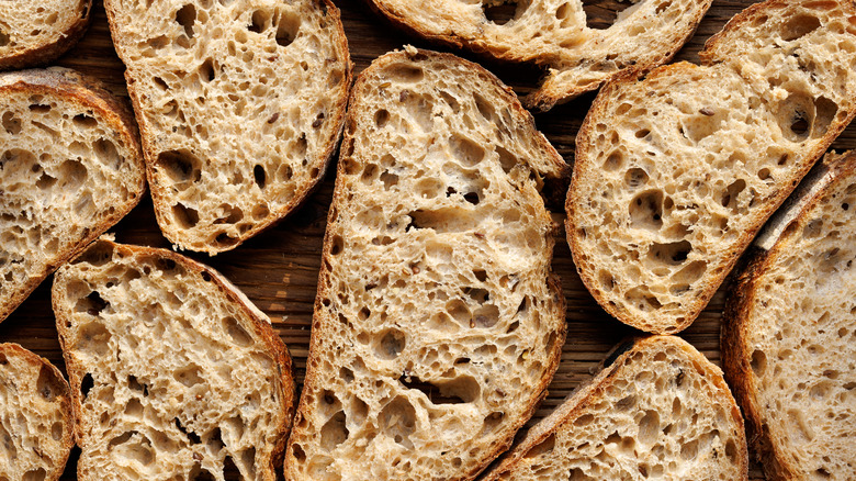 Slices of sourdough bread on board 