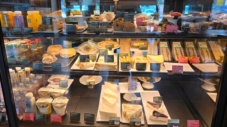 Display of Starbucks foods behind a glass display case