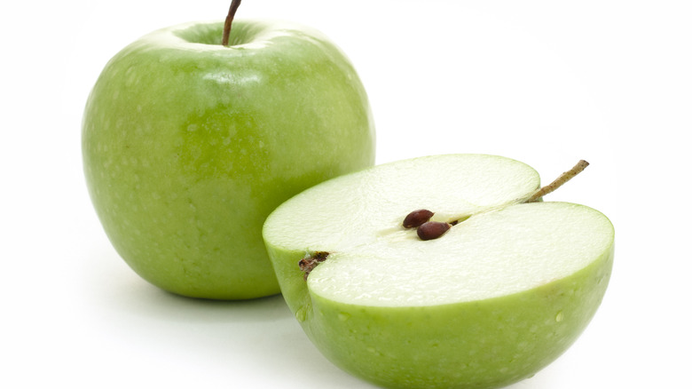 Green apple sliced in half 