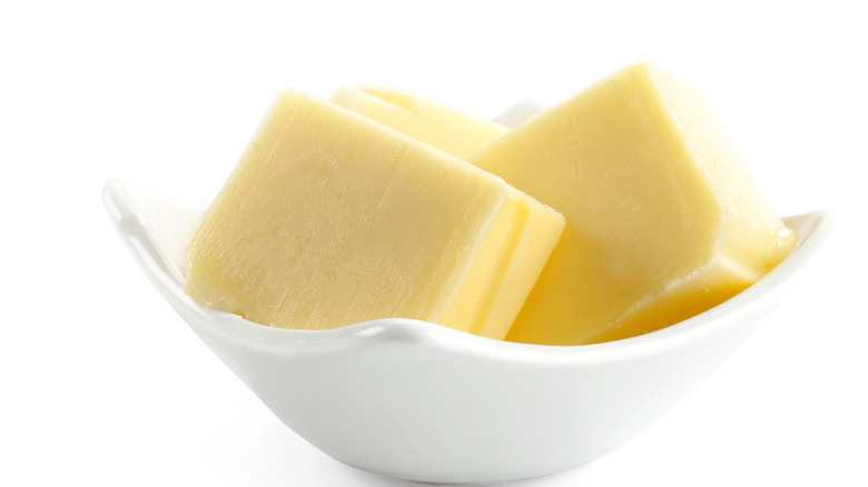 Sliced butter in white dish