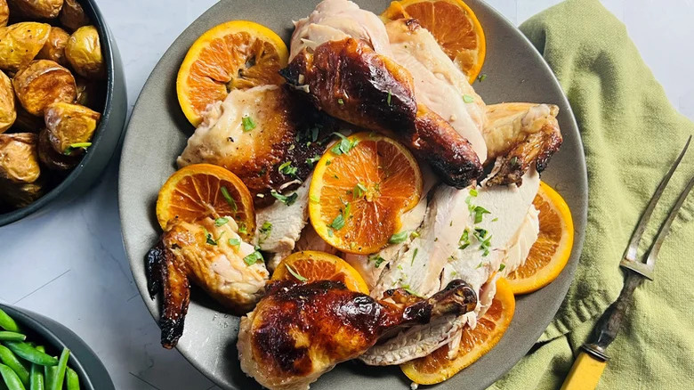 chicken pieces with orange slices