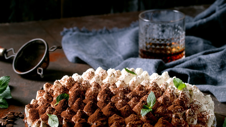 Cake with bourbon in background