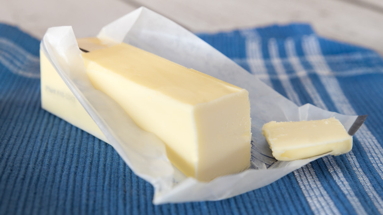 Stick of butter in wrapper 