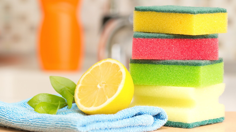 Lemon and stack of sponges