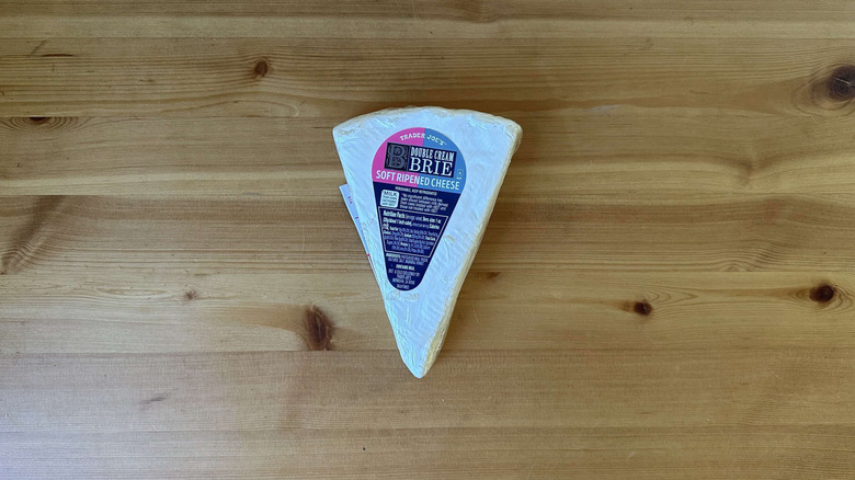 Trader Joe's Brie cheese on wooden table