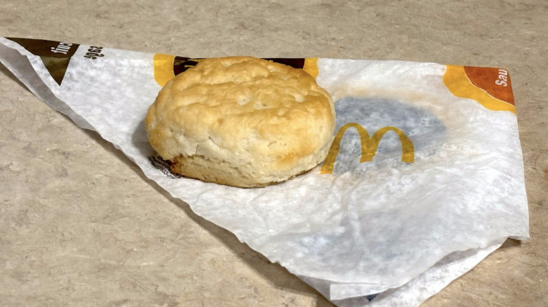 McDonald's biscuit on wrapper on neutral counter top