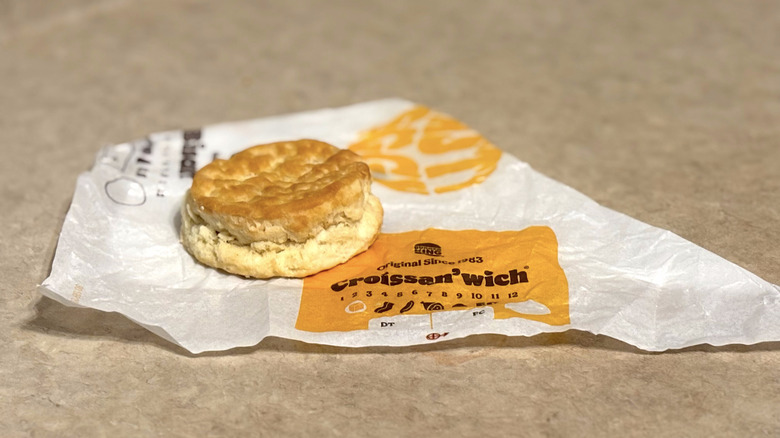 Burger King biscuit on wrapper on neutral counter top