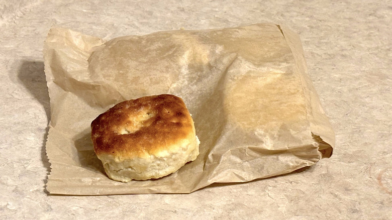 Cracker Barrel biscuit on butcher paper bag on neutral counter top