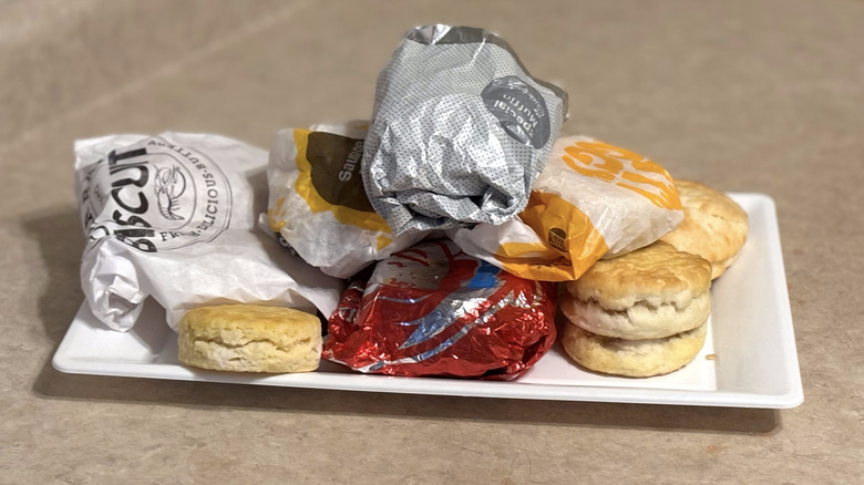 assorted chain biscuits open and in wrappers on white tray on neutral counter top