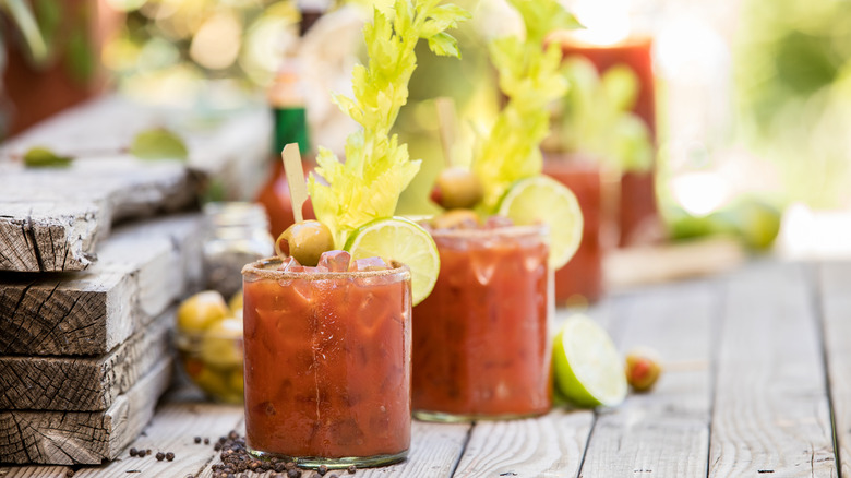 Two Bloody Marys on wooden table