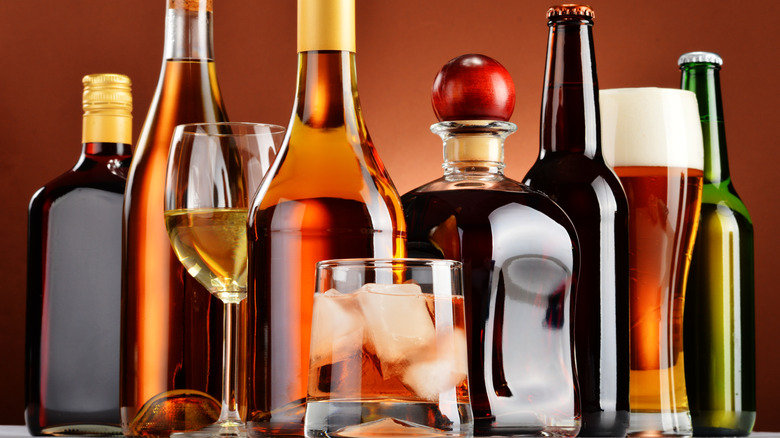 assorted alcohol bottles and glass