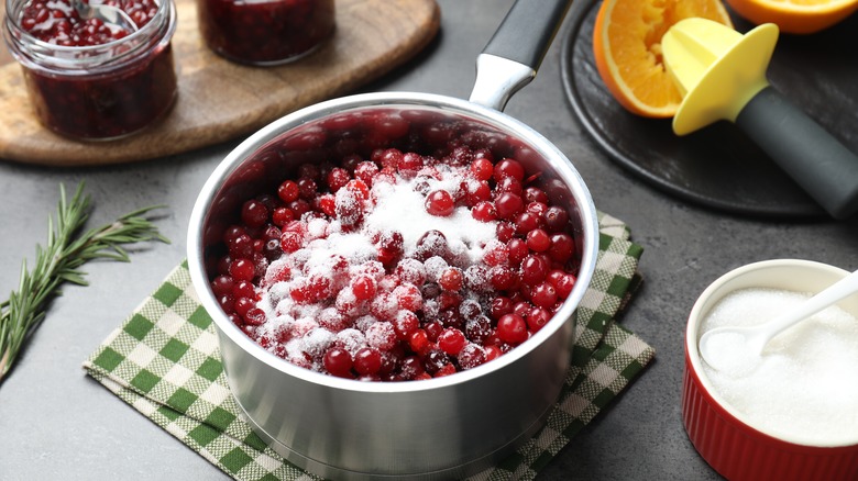 sugar on fresh cranberries in pot