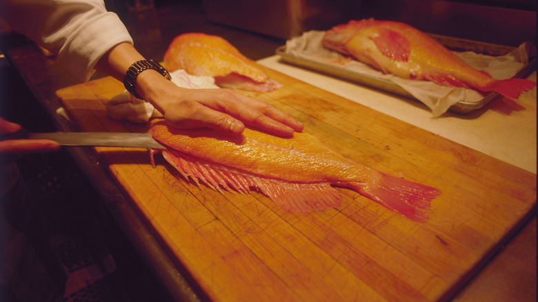Fish being filleted