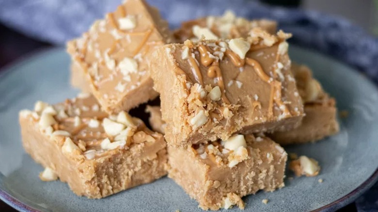 A stack of peanut butter fudge on a plate 