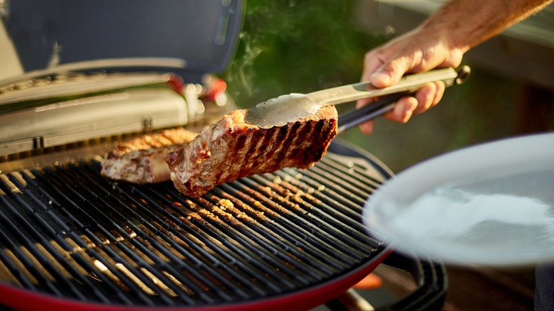 Steaks on backyard grill