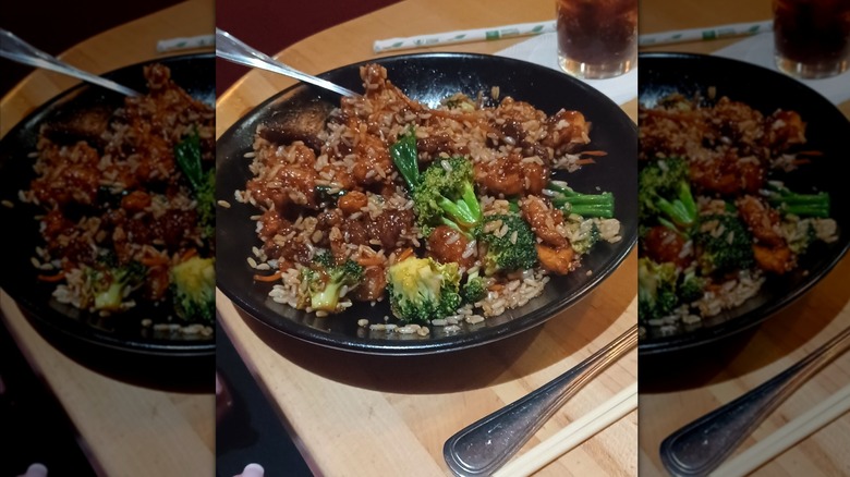 Mongolian beef and rice on black plate at P.F. Chang's