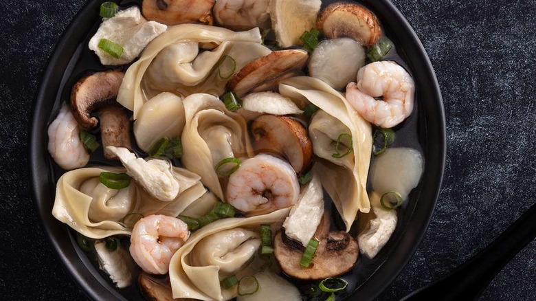 Wonton soup in black bowl from P.F. Chang's