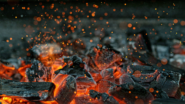 hot charcoals with flying embers