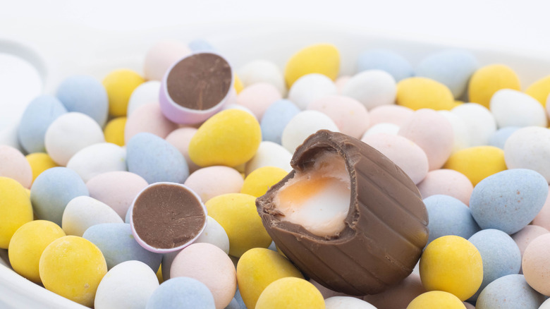 cadbury creme egg on a pile of mini chocolate eggs