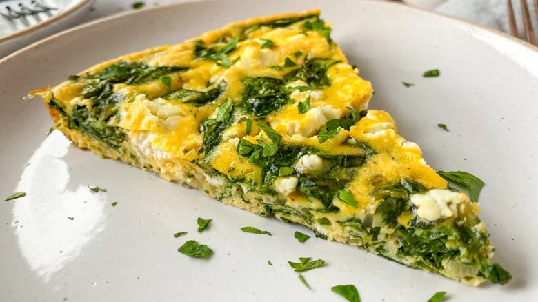 slice of spinach frittata on plate