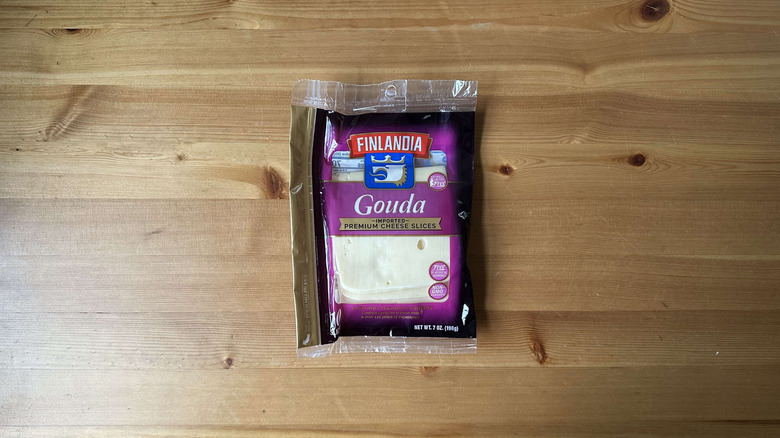 Finlandia Gouda cheese on wooden table