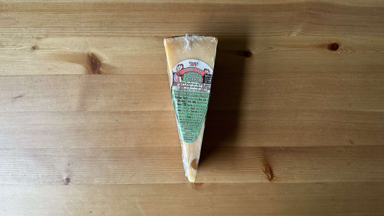 Trader Joe's 1000 Day Gouda Cheese on wooden table