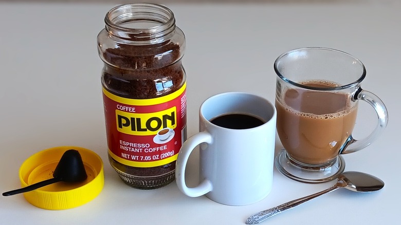 Pilon instant coffee jar and two mugs of coffee