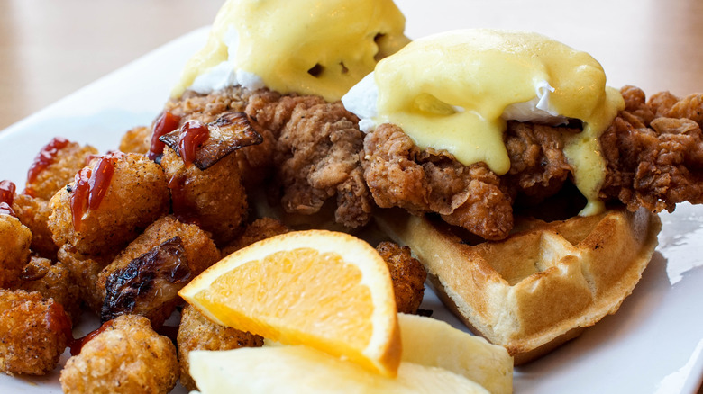 chicken and waffles with eggs benedict and hash browns