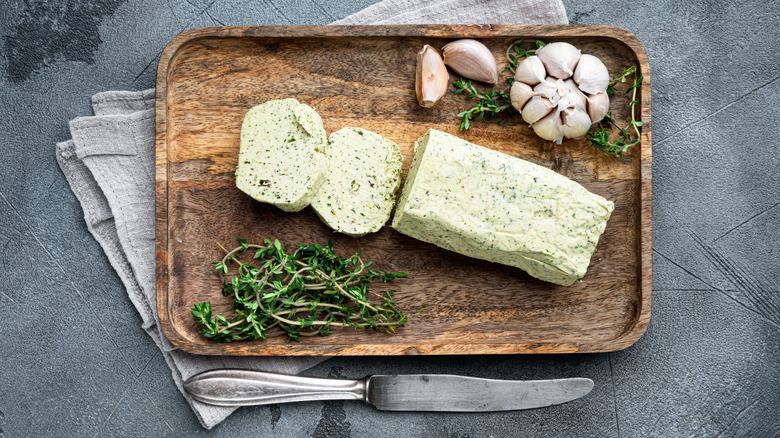 butter with thyme and rosemary and lemon zest