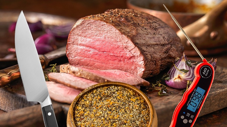 roasted meat with knife and thermometer