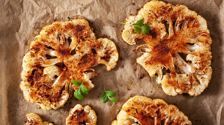 cauliflower steaks on parchment