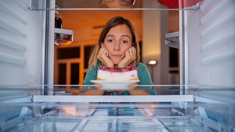 woman looking at cake