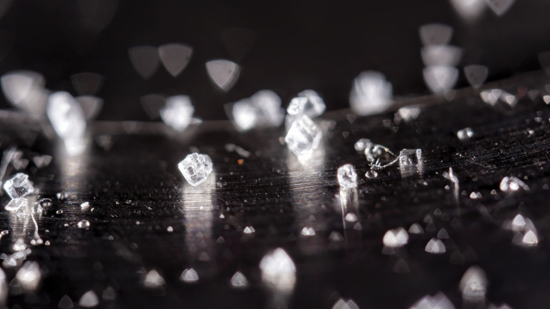 Salt crystals on reflective surface